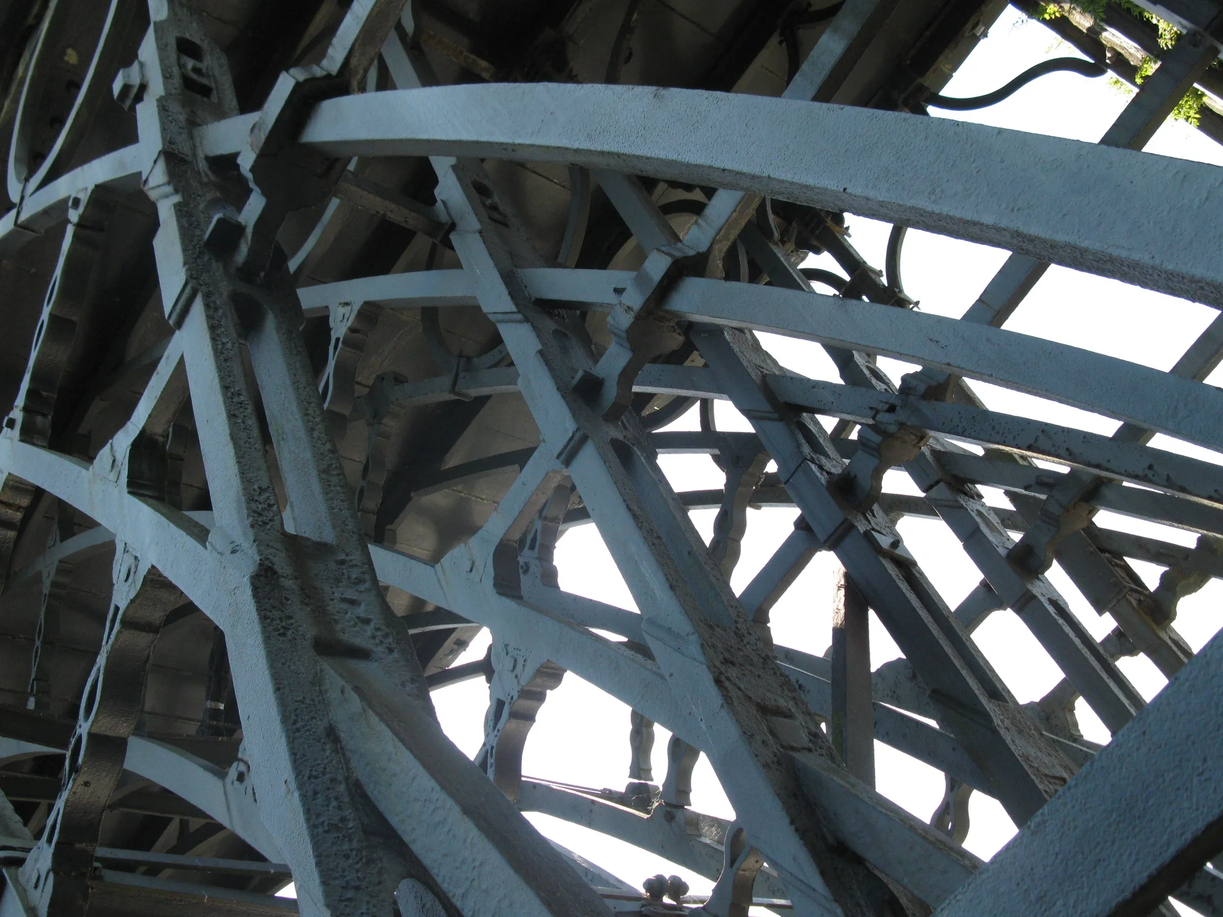 Dense cast ironwork of the Iron Bridge seen from below